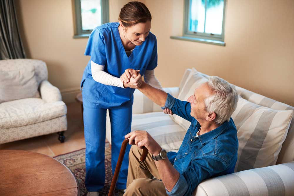 Nurse assisting elderly patient